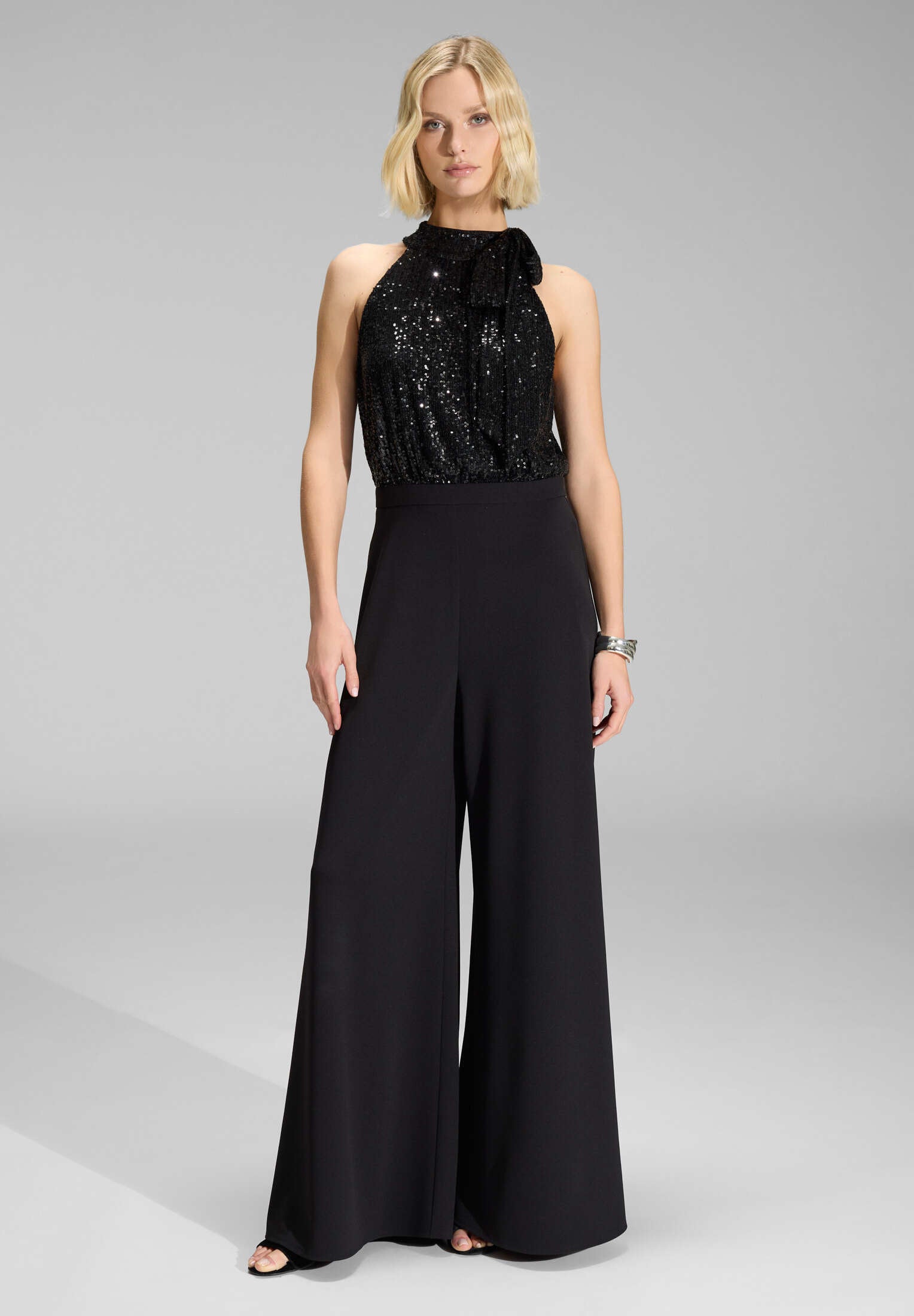 Ärmelloser Jumpsuit mit Schluppenblusen Top aus elastischer Paillette black